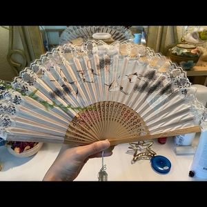 Decorative folding fan. Silky fabric. Lace edged